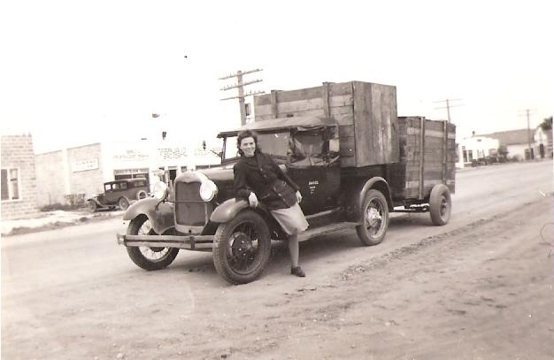 Margaret leaning against loaded truck
