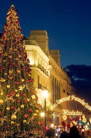 A Christmas tree greets revelers at the Puerta del Sol in Madrid.