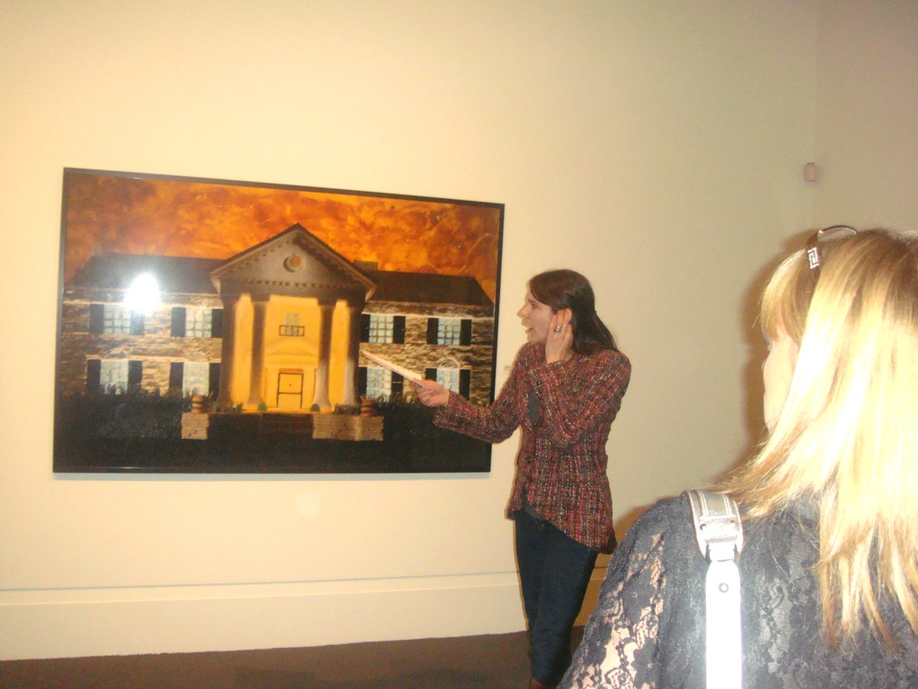 Curator Tara Marshall explaining art work GRACELAND
