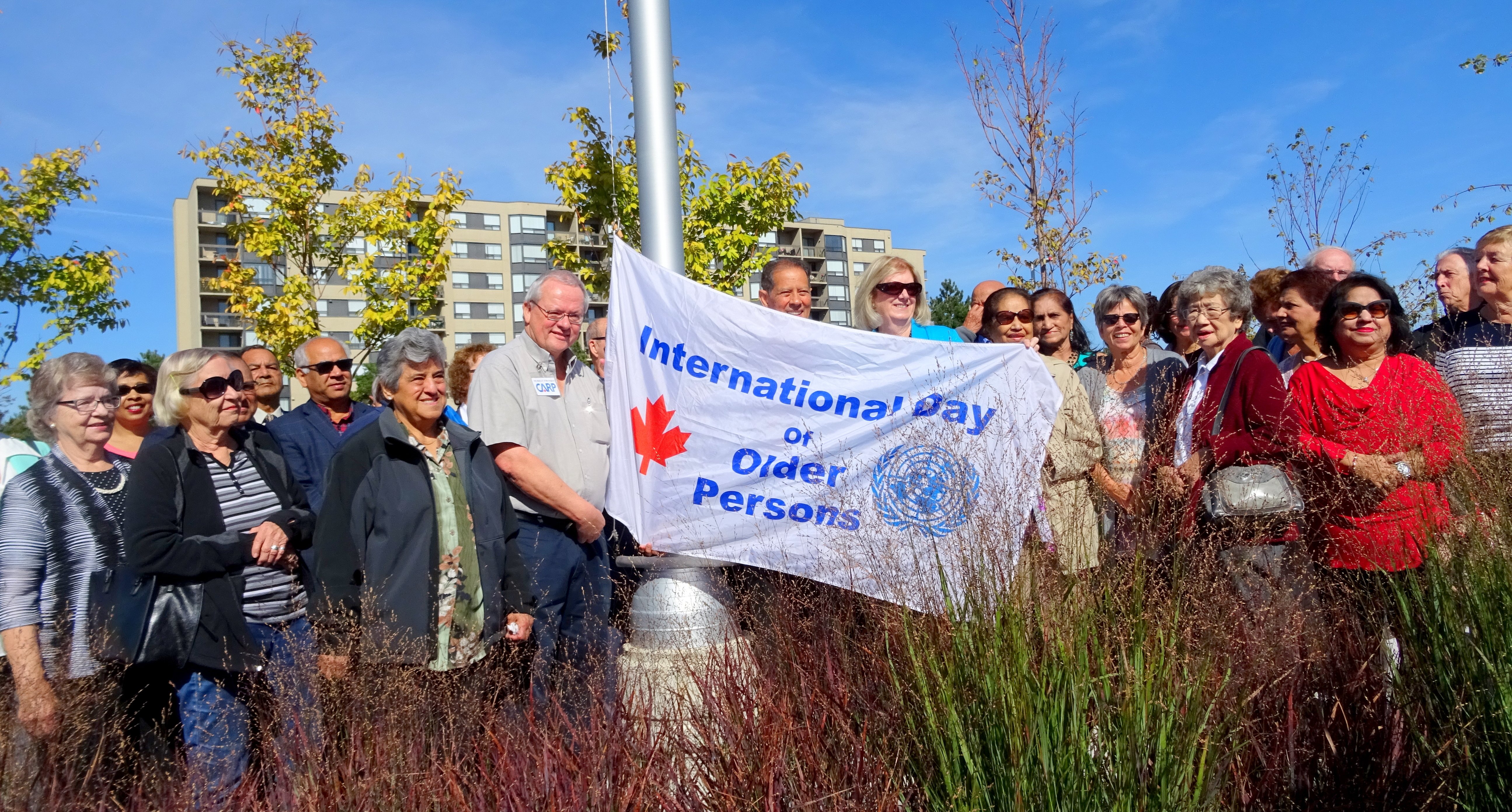 Murray Etherington, Bernard Jordaan, Pat Saito and others at International Day of Older Persons flag raising ceremony, Meadowvale CC, 2 Oct 2017 Photo by I Lee