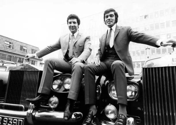 Tom Jones and Engelbert Humperdinck sitting on Rolls Royce Cars in UK 5 Feb 1969. Image source: Getty Images, credit David Farrell/Redferns