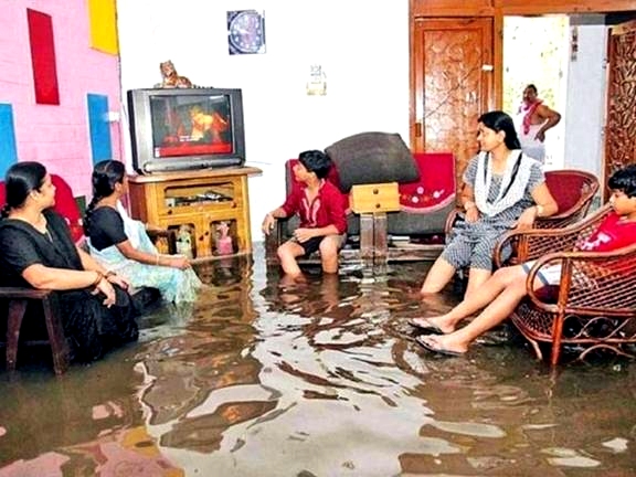 Family in India watching TV in flooded room Google image from http://thechive.com/2009/05/27/the-funny-side-of-floods-32-photos/funny-flood-gallery-27/ Author: Leo 25 May 2009