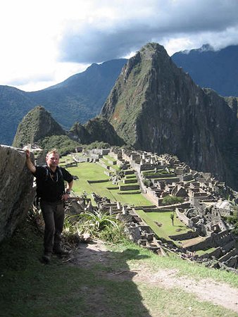 Dr Kujtan at Huayna Picchu above the ruins of Machu Picchu