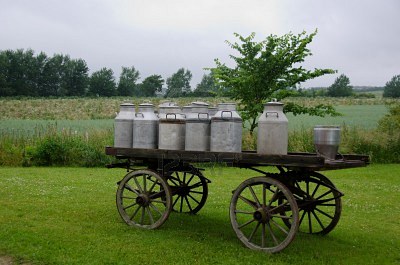 Traditional milk cans on a wooden horse and cart Google image from http://us.123rf.com/400wm/400/400/arrxxx/arrxxx1108/arrxxx110800043/10320293-old-traditional-milk-cans-on-a-wooden-horse-and-cart.jpg