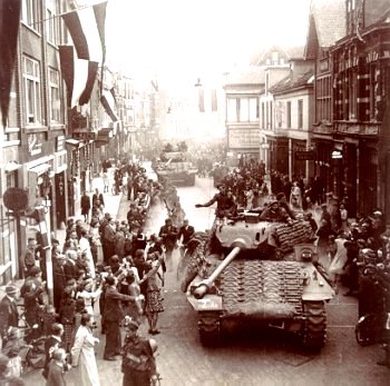 On 17 April, 1945, the Canadian lead tanks roll into Apeldoorn, loudly cheered by relieved residents - image from http://www.bouwman.com/netherlands/Liberation.html